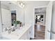 Bathroom featuring a double vanity with quartz countertops and views into the bedroom at 609 Chopper Ln # Homesite 10, Durham, NC 27703