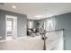 Inviting loft space with seating area, shelving, and natural light at 609 Chopper Ln # Homesite 10, Durham, NC 27703