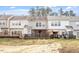 The backyard has a covered outdoor area on a manicured lawn, perfect for outdoor living at 610 Canyon Lake Cir, Morrisville, NC 27560