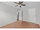 Bedroom featuring hardwood floors, a ceiling fan, and doorway to hallway at 610 Canyon Lake Cir, Morrisville, NC 27560