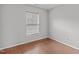 Bedroom featuring a window with natural light and vinyl flooring at 610 Canyon Lake Cir, Morrisville, NC 27560