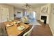 Dining area showcasing an open layout with views of the living room and access to the outdoor space at 610 Canyon Lake Cir, Morrisville, NC 27560