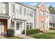 Charming townhome featuring neutral siding, brick accents, shuttered windows, and a private balcony at 610 Canyon Lake Cir, Morrisville, NC 27560