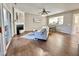 Cozy living room featuring a fireplace, sliding glass doors, and an open view into the dining area at 610 Canyon Lake Cir, Morrisville, NC 27560