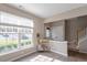 Bright living room with large windows and a staircase leading to the upper level at 610 Canyon Lake Cir, Morrisville, NC 27560