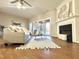 Comfortable living room featuring a fireplace, hardwood floors and sliding glass doors leading to the backyard at 610 Canyon Lake Cir, Morrisville, NC 27560