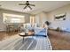 Open living room featuring a large window, neutral paint, and hardwood floors at 610 Canyon Lake Cir, Morrisville, NC 27560