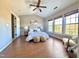 Bright main bedroom with vaulted ceiling, lots of natural light, and two cushioned ottomans at 610 Canyon Lake Cir, Morrisville, NC 27560