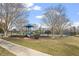 Community playground area with play structures, slides, and tennis courts in the background at 610 Canyon Lake Cir, Morrisville, NC 27560