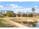 A scenic pond adds natural beauty to this property and community at 610 Canyon Lake Cir, Morrisville, NC 27560