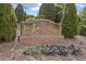 Entrance to the Breckenridge Swim & Tennis Club, nestled amongst mature trees and landscaping at 610 Canyon Lake Cir, Morrisville, NC 27560