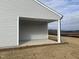 Covered patio with concrete flooring, offering an outdoor space for relaxation at 6845 Galloway Dr, Middlesex, NC 27557