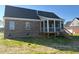 Lovely screened-in back porch providing an excellent space for relaxation and entertainment at 7553 Sweetwater Dr, Nashville, NC 27856