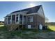 Lovely screened-in back porch providing an excellent space for relaxation and entertainment at 7553 Sweetwater Dr, Nashville, NC 27856