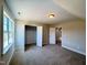 Bedroom has a closet, neutral carpet and paint, and a window for natural light at 7553 Sweetwater Dr, Nashville, NC 27856