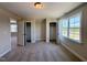 Inviting bedroom with carpet, white trim, natural light from a window, and a spacious closet at 7553 Sweetwater Dr, Nashville, NC 27856