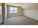 Bright bedroom with carpet, neutral walls, natural light from a window, and a storage closet at 7553 Sweetwater Dr, Nashville, NC 27856