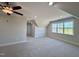 Bonus room featuring carpet floors, ceiling fan, and bright windows at 7553 Sweetwater Dr, Nashville, NC 27856