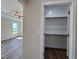 Spacious walk-in closet with ample shelving, offering convenient storage space at 7553 Sweetwater Dr, Nashville, NC 27856