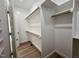 Walk-in closet features generous shelving and hanging space for organized storage solutions at 7553 Sweetwater Dr, Nashville, NC 27856