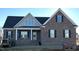 New construction home with a neutral color brick exterior at 7553 Sweetwater Dr, Nashville, NC 27856