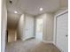 Hallway with carpeted floor gives access to multiple rooms and a closet at 7553 Sweetwater Dr, Nashville, NC 27856