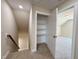 Hallway with view of bedroom and walk-in storage space at 7553 Sweetwater Dr, Nashville, NC 27856