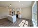 Bright kitchen with white cabinets, stainless steel appliances, and a kitchen island at 7553 Sweetwater Dr, Nashville, NC 27856