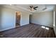Bright main bedroom features trey ceiling, ceiling fan, hardwood floors and an ensuite bathroom at 7553 Sweetwater Dr, Nashville, NC 27856