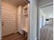 Bright mudroom features wood-look tile flooring, a built-in storage bench, and access to the main living area at 7553 Sweetwater Dr, Nashville, NC 27856