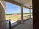 Open porch with classic columns and an inviting space for relaxation and outdoor enjoyment at 7553 Sweetwater Dr, Nashville, NC 27856