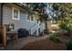 Backyard features a small patio area with a grill, storage, and lush garden space at 205 N Boundary St, Chapel Hill, NC 27514