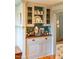Custom built in wet bar with upper glass shelving at 205 N Boundary St, Chapel Hill, NC 27514
