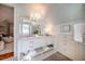 This bathroom includes tiled floors, double sinks, marble countertops and wallpapered walls at 205 N Boundary St, Chapel Hill, NC 27514