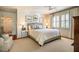 Spacious bedroom featuring a large bed, hardwood floors, and natural light from the windows at 205 N Boundary St, Chapel Hill, NC 27514