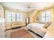 This bedroom features shuttered windows, ample natural light, and a sitting area at 205 N Boundary St, Chapel Hill, NC 27514