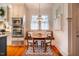Cozy breakfast nook with built-in seating, a round table, and natural light from the window at 205 N Boundary St, Chapel Hill, NC 27514
