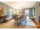 Elegant dining room featuring a chandelier, a round table with seating for six, and hardwood floors at 205 N Boundary St, Chapel Hill, NC 27514