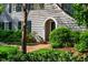 Charming home with manicured front yard landscaping and an arched front door at 205 N Boundary St, Chapel Hill, NC 27514