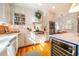 Well-equipped kitchen featuring white cabinets, stainless steel appliances, and a sunlit breakfast nook at 205 N Boundary St, Chapel Hill, NC 27514