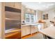 Bright kitchen with stainless steel appliances, white cabinets, and an undermount sink at 205 N Boundary St, Chapel Hill, NC 27514