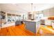 Spacious kitchen featuring a center island, stainless steel appliances, and views into the living room at 205 N Boundary St, Chapel Hill, NC 27514