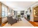 Bright living room with built-in bookshelves, fireplace, neutral palette and hardwood floors at 205 N Boundary St, Chapel Hill, NC 27514