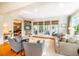 Bright living room with hardwood floors, fireplace, built-in shelving, and access to a patio at 205 N Boundary St, Chapel Hill, NC 27514