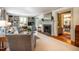 Spacious living room with a cozy fireplace, built-in shelving, and comfortable seating arrangements at 205 N Boundary St, Chapel Hill, NC 27514