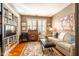 Cozy living room features a decorative rug, a couch, and large bookcase at 205 N Boundary St, Chapel Hill, NC 27514
