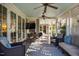 Inviting porch with ceiling fans, comfortable seating, and views of lush landscaping at 205 N Boundary St, Chapel Hill, NC 27514