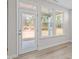 An indoor view of the glass-paneled door and windows, all in a white-walled room at 317 Highland Ridge Ln, Knightdale, NC 27545