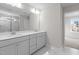 Stylish bathroom with double sinks, and open access to the glass shower at 317 Highland Ridge Ln, Knightdale, NC 27545