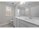 Bathroom with a double sink vanity, natural lighting and chrome fixtures at 317 Highland Ridge Ln, Knightdale, NC 27545